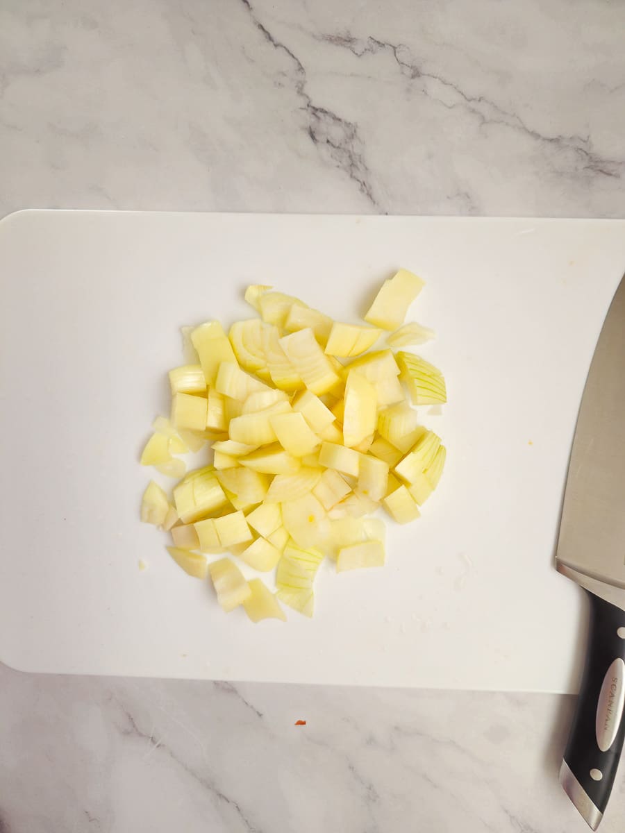 dicing onions on chopping board