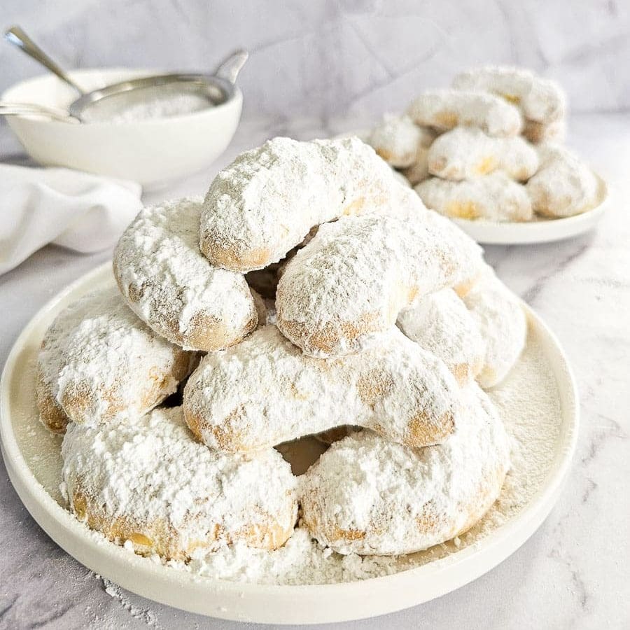 Greek Almond Shortbread Cookies-Kourambiedes-on white plate
