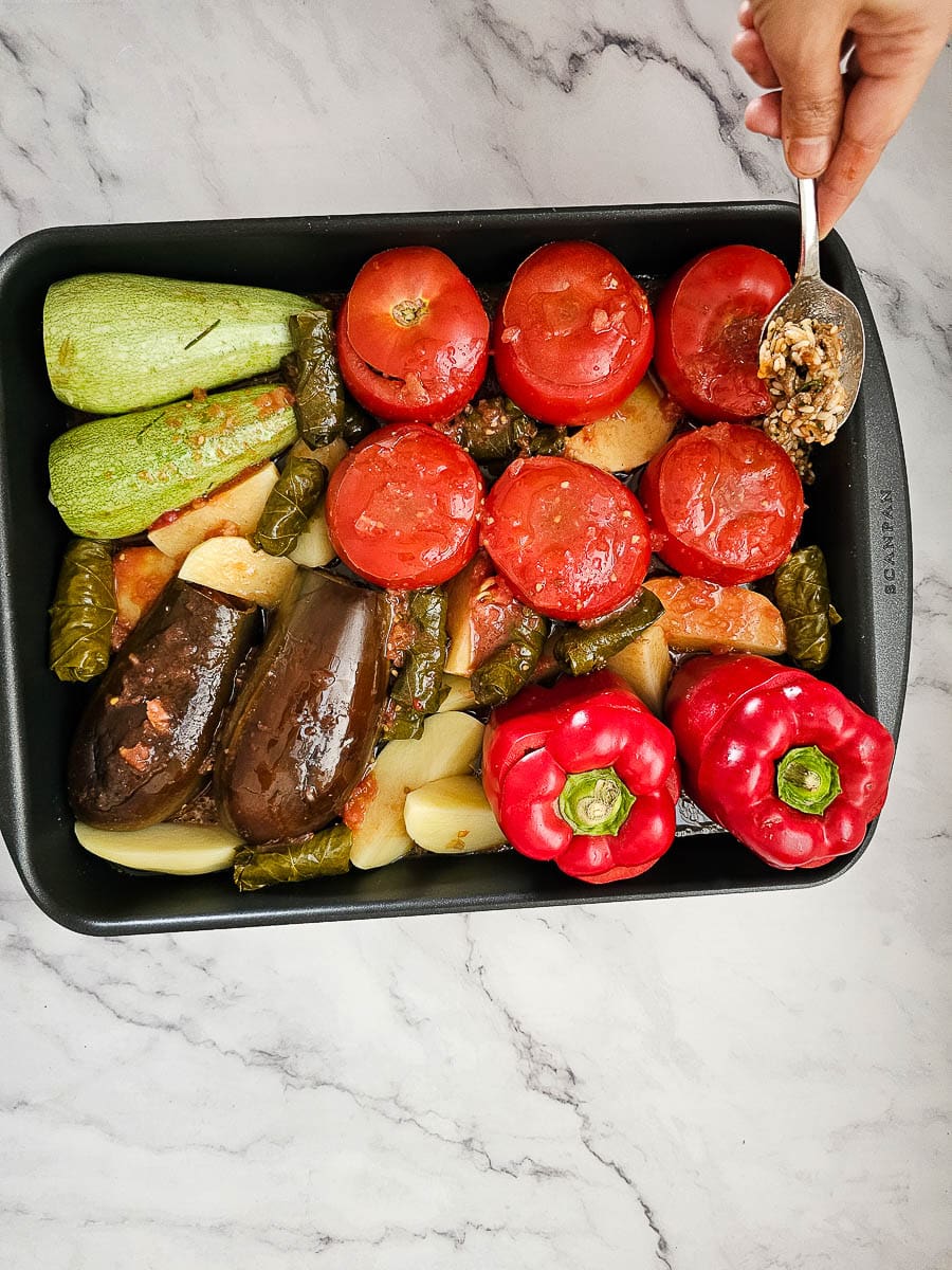 Yemista - Greek Stuffed Tomatoes with Rice in a baking dish before baking