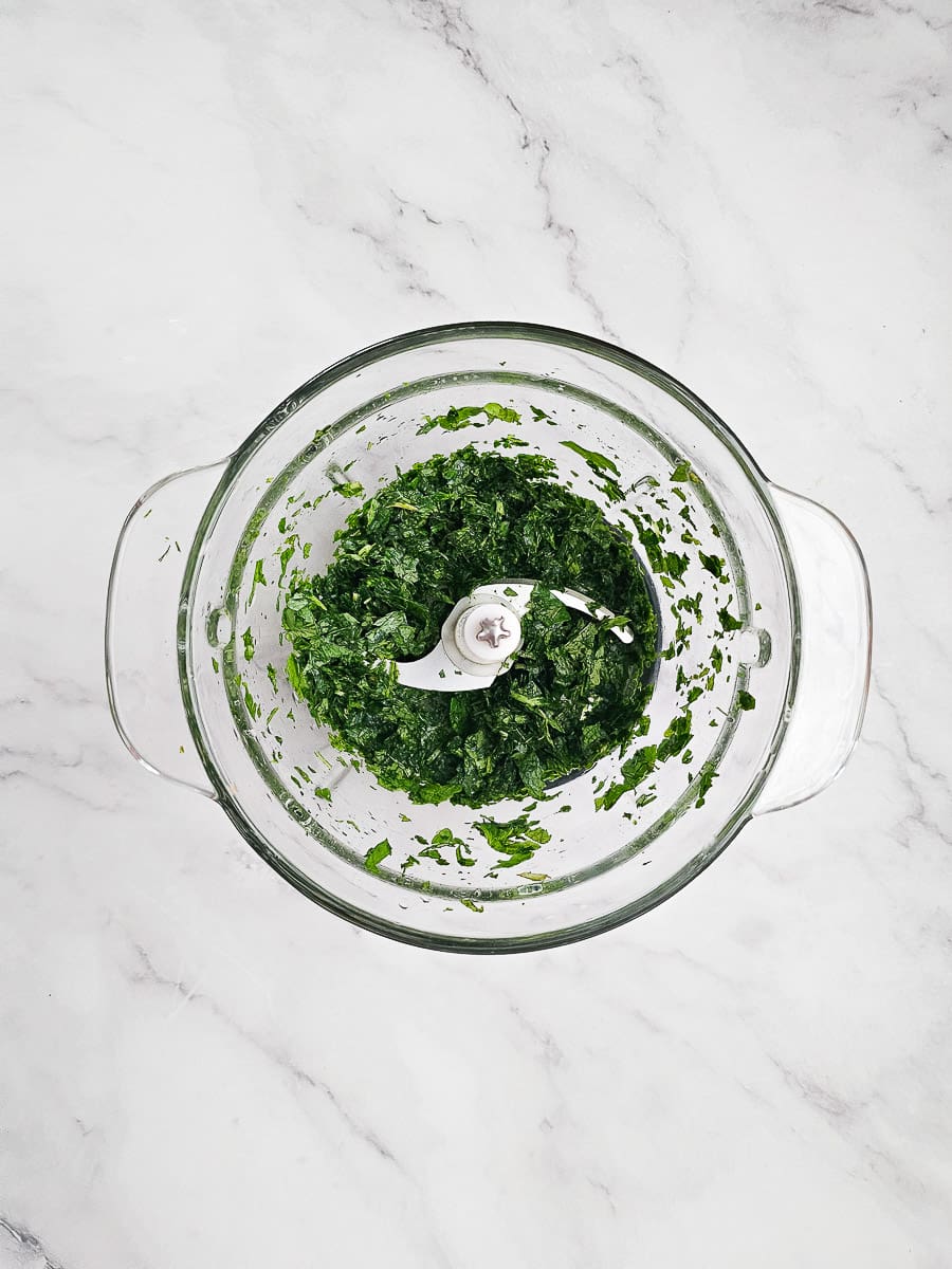 chopping parsley and mint in food processor
