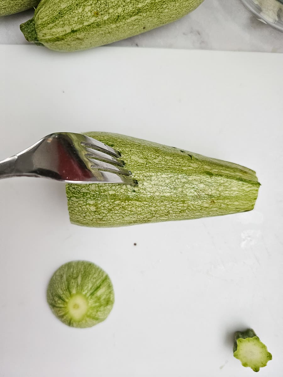 preparing zucchini for Yemista - Greek Stuffed Tomatoes with Rice and meat
