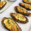 Papoutsakia - Greek stuffed eggplant- on a plate.
