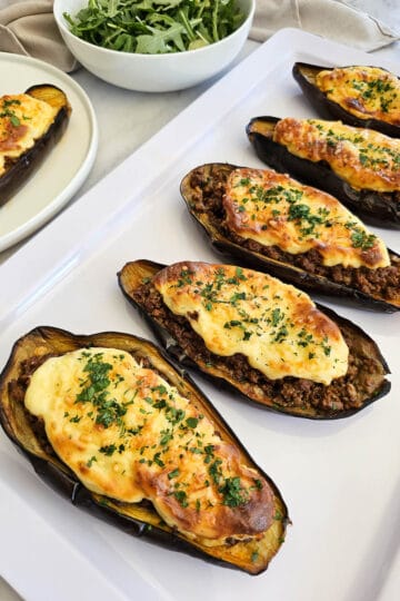 Papoutsakia - Greek stuffed eggplant- on a plate.
