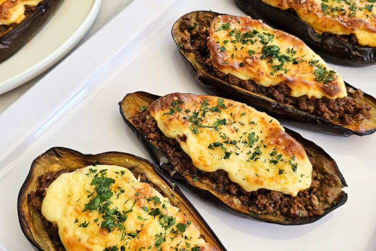 Papoutsakia - Greek stuffed eggplant- on a plate.