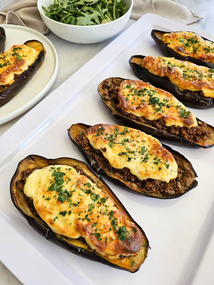 Papoutsakia - Greek stuffed eggplant- on a plate.