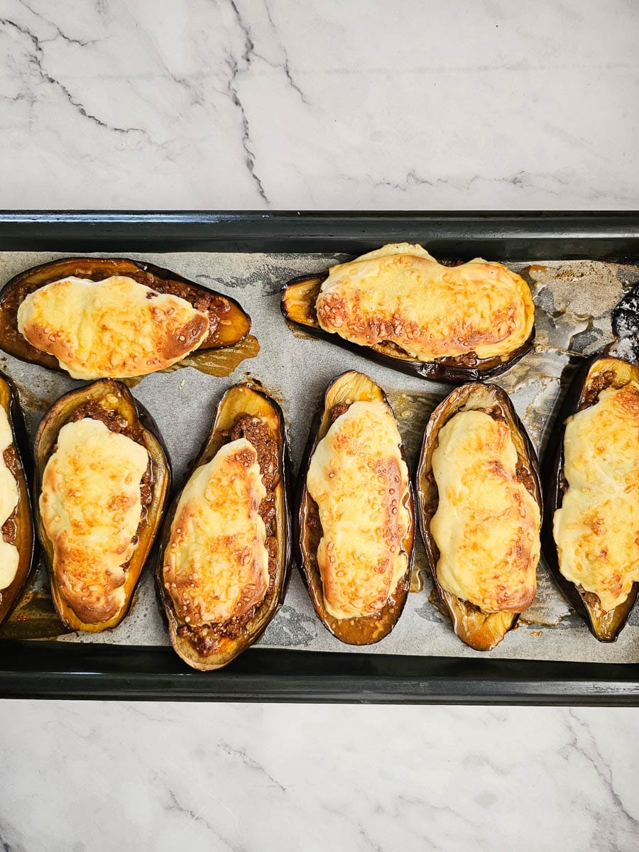 papoutsakia greek stuffed eggplant on baking tray