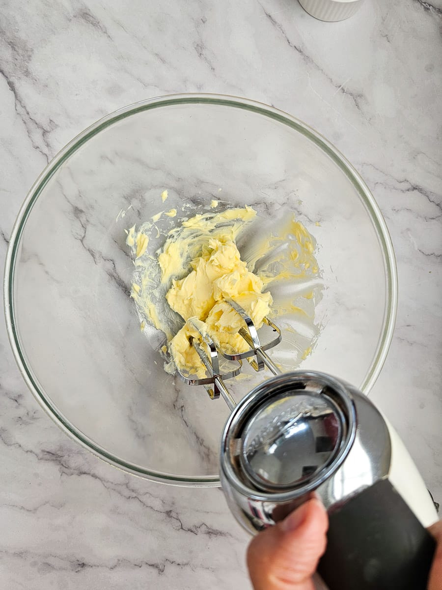 beat butter in glass bowl