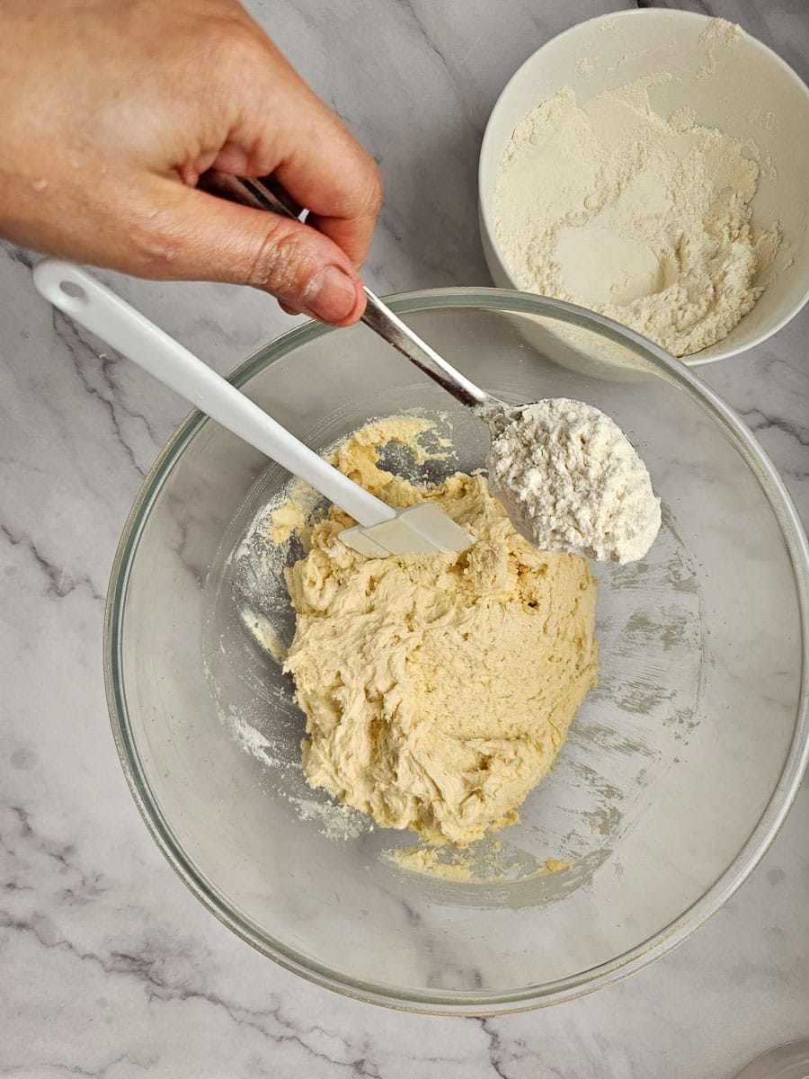 add flour one tablespoon at a time to dough