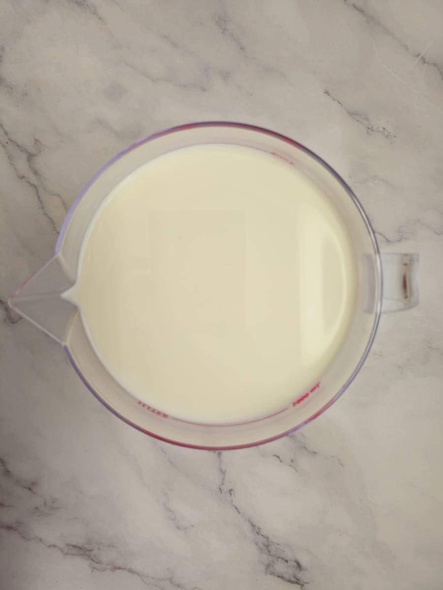 milk in measuring jug