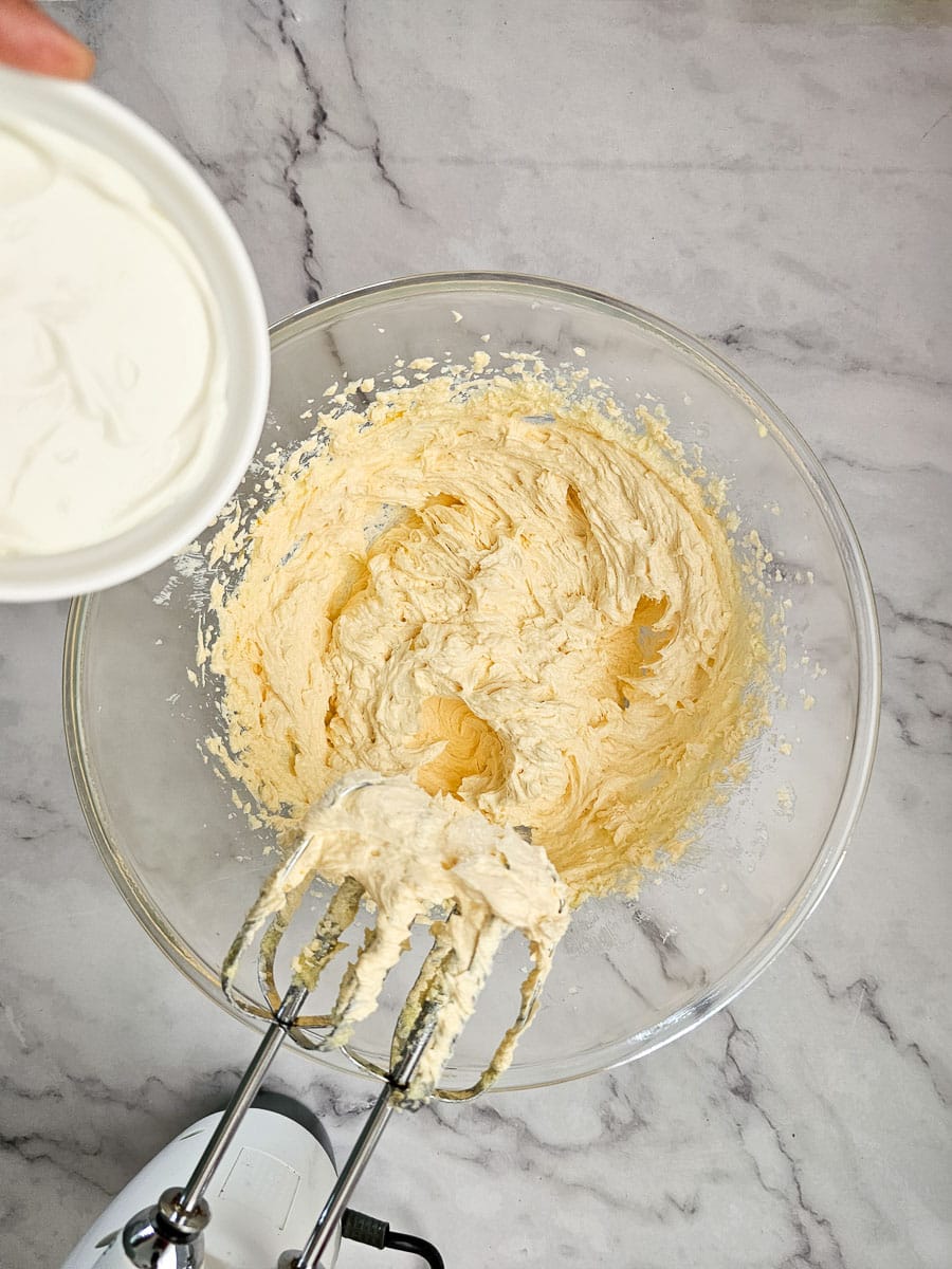 add yoghurt to creamed butter, sugar and egg